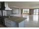 Open living area with tile flooring, breakfast bar, and large windows offering natural light at 115 W Peachtree Nw Pl # 702, Atlanta, GA 30313