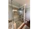 Bathroom with large glass shower and tiled floors at 2510 Lakeshore Ne Dr, Conyers, GA 30012