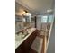 Bathroom with dark wood cabinets, granite countertops, and stand up shower at 2510 Lakeshore Ne Dr, Conyers, GA 30012