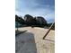 Exterior view of a sandy beach with recreational equipment, including a picnic shelter and swing at 2510 Lakeshore Ne Dr, Conyers, GA 30012