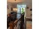 Bright landing with chandelier lighting and hardwood floors that lead to the home's main entry at 2510 Lakeshore Ne Dr, Conyers, GA 30012