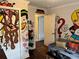 Living room featuring hardwood floors, gray couch, and unique hand drawn custom cartoon wall art at 2510 Lakeshore Ne Dr, Conyers, GA 30012