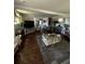Open concept living space with dark wood floors, neutral colors and ample seating and decor at 2510 Lakeshore Ne Dr, Conyers, GA 30012