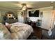 Relaxing main bedroom with ceiling fan, TV, and natural light at 2510 Lakeshore Ne Dr, Conyers, GA 30012