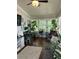 Cozy sunroom filled with potted plants and large windows for natural light and relaxing views at 2510 Lakeshore Ne Dr, Conyers, GA 30012
