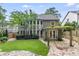 Charming backyard featuring lush lawn and stone patio, perfect for outdoor entertaining and relaxing at 2544 Thompson Ne Rd, Brookhaven, GA 30319