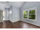 Bedroom featuring hardwood floors and a bright window, creating a welcoming and spacious atmosphere at 2544 Thompson Ne Rd, Brookhaven, GA 30319