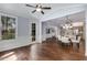 Open concept dining room flows to living spaces, showcasing hardwood floors and natural light at 2544 Thompson Ne Rd, Brookhaven, GA 30319