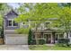 Charming two-story home boasts beautiful landscaping, a two-car garage, and a welcoming front porch at 2544 Thompson Ne Rd, Brookhaven, GA 30319