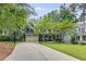 Charming two-story home with a well-manicured lawn and a long driveway leading to a two-car garage at 2544 Thompson Ne Rd, Brookhaven, GA 30319