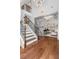 Bright foyer featuring a staircase and stylish sliding barn door leading to the office at 2544 Thompson Ne Rd, Brookhaven, GA 30319