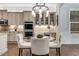 Kitchen featuring stainless steel appliances, custom cabinetry, and a breakfast nook with modern lighting at 2544 Thompson Ne Rd, Brookhaven, GA 30319