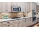 Kitchen featuring stainless steel appliances, granite countertops, and a decorative tile backsplash at 2544 Thompson Ne Rd, Brookhaven, GA 30319