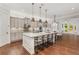 Spacious kitchen featuring a large island with seating, granite countertops, and modern appliances at 2544 Thompson Ne Rd, Brookhaven, GA 30319