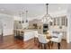 Open kitchen layout featuring a breakfast bar, dining area, and modern appliances at 2544 Thompson Ne Rd, Brookhaven, GA 30319