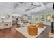 Spacious living room with hardwood floors, coffered ceiling, and open access to the kitchen at 2544 Thompson Ne Rd, Brookhaven, GA 30319