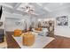 Living room showcases hardwood floors, stone fireplace, and seamless transition to the kitchen at 2544 Thompson Ne Rd, Brookhaven, GA 30319