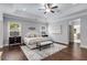 Spacious main bedroom with tray ceiling, hardwood floors, and sitting area at 2544 Thompson Ne Rd, Brookhaven, GA 30319