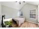 Cozy bedroom with vaulted ceilings, light walls, and wood-look flooring at 7033 Brecken Trce, Lithonia, GA 30058