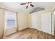 Comfortable bedroom boasts hardwood floors, vaulted ceilings, and ample natural light at 7033 Brecken Trce, Lithonia, GA 30058