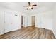 Open and airy bedroom with vaulted ceilings, hardwood floors, and multiple doors at 7033 Brecken Trce, Lithonia, GA 30058
