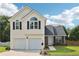 Charming two-story home with a two-car garage and well-maintained front yard at 7033 Brecken Trce, Lithonia, GA 30058
