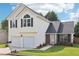 Charming two-story home with a two-car garage and well-maintained front yard at 7033 Brecken Trce, Lithonia, GA 30058