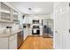 Modern kitchen featuring stainless steel appliances, granite countertops, and white cabinetry at 7033 Brecken Trce, Lithonia, GA 30058