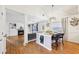Bright kitchen island with granite countertops and a view into the cozy living room at 7033 Brecken Trce, Lithonia, GA 30058