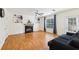 Cozy living room with fireplace, hardwood floors, and natural light at 7033 Brecken Trce, Lithonia, GA 30058