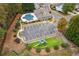 Community aerial view showcasing the pool, clubhouse, parking, and playground at 8010 Majors Mill Dr, Cumming, GA 30041