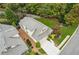 Aerial view featuring the home's landscaped yard, driveway, and surrounding neighborhood at 8010 Majors Mill Dr, Cumming, GA 30041