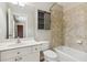 Bathroom with a single sink vanity and tiled tub and shower combination at 8010 Majors Mill Dr, Cumming, GA 30041
