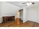 Cozy bedroom with hardwood floors, sloped ceilings, and a stylish built-in cabinet at 8010 Majors Mill Dr, Cumming, GA 30041