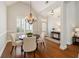 Elegant dining room with wood floors and a modern chandelier fixture at 8010 Majors Mill Dr, Cumming, GA 30041