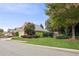 Charming home exterior with lush landscaping, mature trees, and well-manicured lawn at 8010 Majors Mill Dr, Cumming, GA 30041
