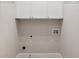 Empty Laundry Room with overhead storage cabinets at 8010 Majors Mill Dr, Cumming, GA 30041