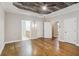 Spacious main bedroom featuring hardwood floors and a decorative wood plank ceiling with a fan at 8010 Majors Mill Dr, Cumming, GA 30041