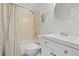 Well-maintained bathroom features a vanity, updated fixtures, and shower-tub combination with a patterned shower curtain at 828 Ivy Ne Cv, Norcross, GA 30071