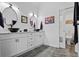 Elegant bathroom featuring double vanity sinks, modern fixtures, and a separate toilet room at 828 Ivy Ne Cv, Norcross, GA 30071