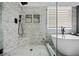 Beautiful bathroom featuring a modern tub, glass shower, and stylish tile work at 828 Ivy Ne Cv, Norcross, GA 30071