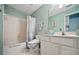 Traditional bathroom featuring a shower/tub combo and a vanity with storage at 828 Ivy Ne Cv, Norcross, GA 30071