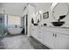Bright, spacious bathroom featuring double sinks, a tub, and glass shower at 828 Ivy Ne Cv, Norcross, GA 30071