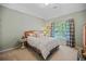 Inviting bedroom with a comfortable bed, side tables, and large windows with natural light at 828 Ivy Ne Cv, Norcross, GA 30071