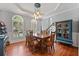 Bright dining room with hardwood floors, modern lighting, and stylish decor at 828 Ivy Ne Cv, Norcross, GA 30071