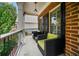 Inviting front porch with brick facade and seating area perfect for enjoying the outdoors at 828 Ivy Ne Cv, Norcross, GA 30071