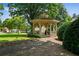Community gazebo surrounded by lush greenery and mature trees at 828 Ivy Ne Cv, Norcross, GA 30071