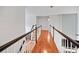 Bright hallway with hardwood floors and white wainscoting exudes a welcoming and airy ambiance at 828 Ivy Ne Cv, Norcross, GA 30071
