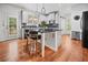 Modern kitchen with granite countertops, stainless steel appliances, and breakfast bar seating at 828 Ivy Ne Cv, Norcross, GA 30071