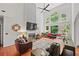 Spacious living room with soaring ceilings, a fireplace, and large windows offering ample natural light at 828 Ivy Ne Cv, Norcross, GA 30071